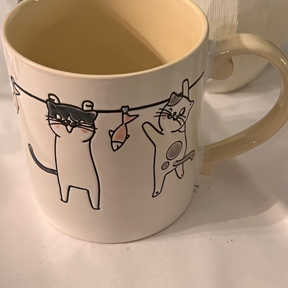 Playful Cat and fish on a laundry line Mug yellow 20oz